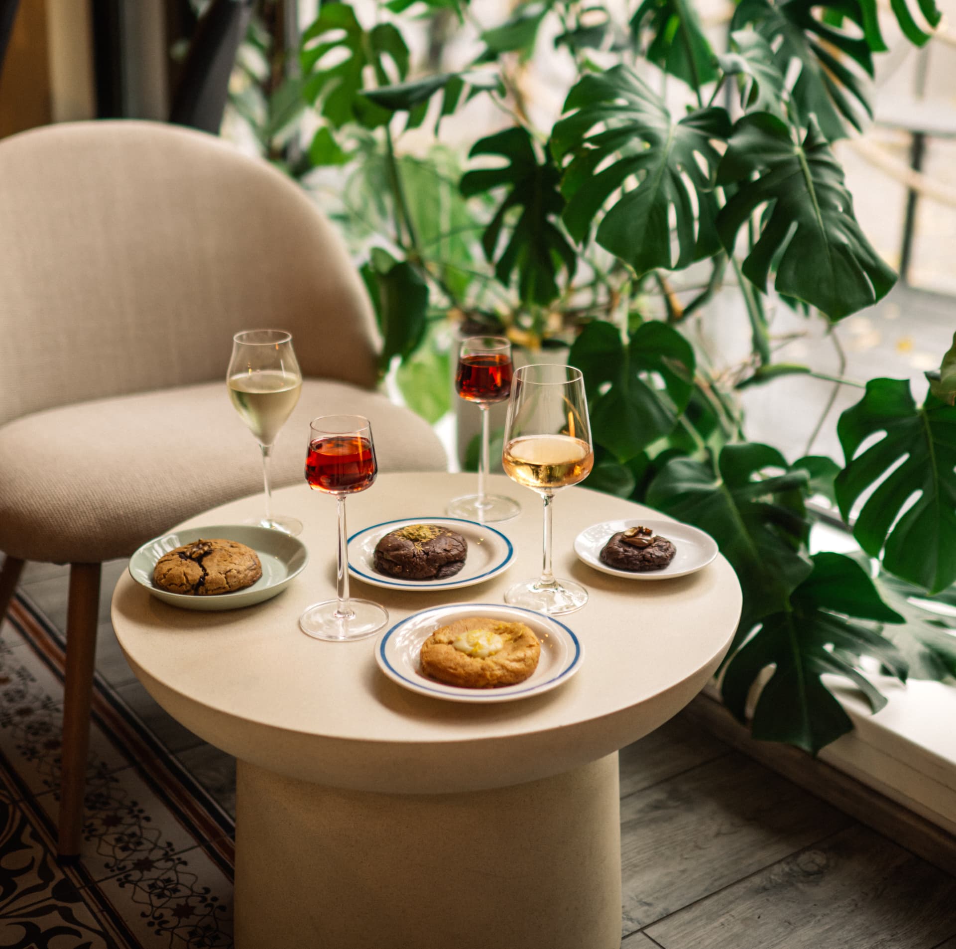Wine glasses and cookies on a round table by the café window